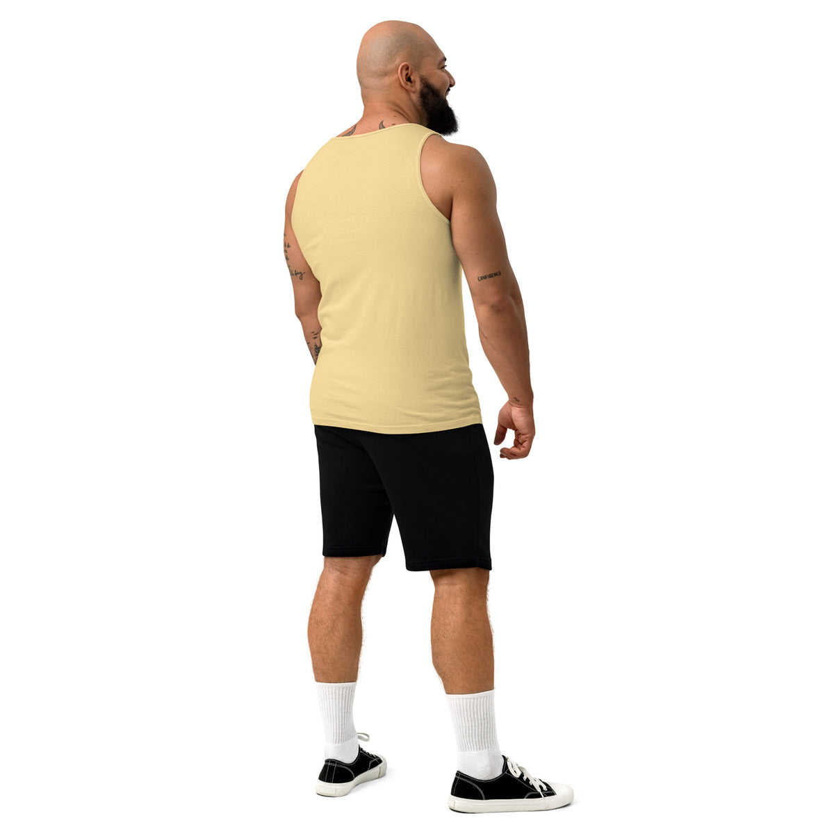Back view of a model wearing the plain butter-yellow tank top