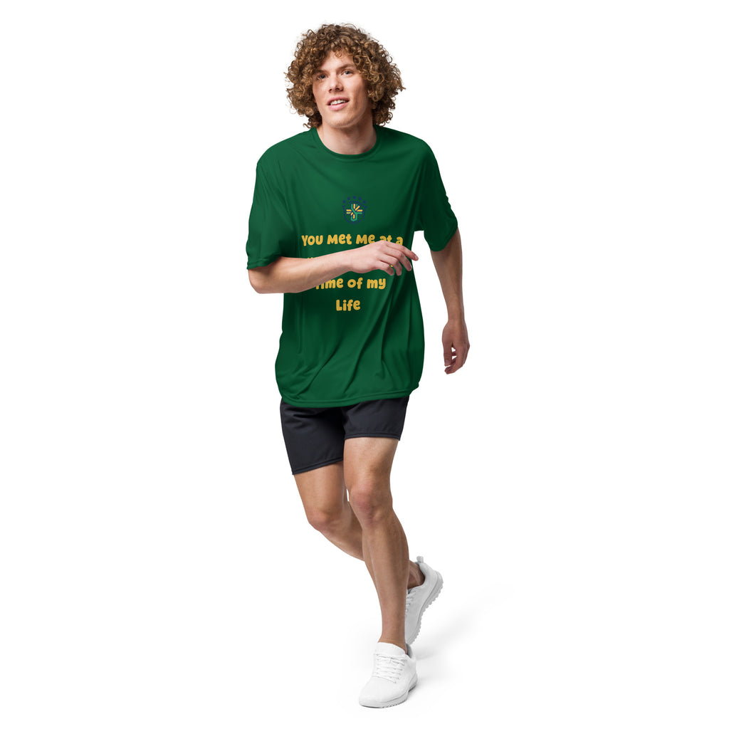 Front view of a model walking in the forest-green graphic performance tee