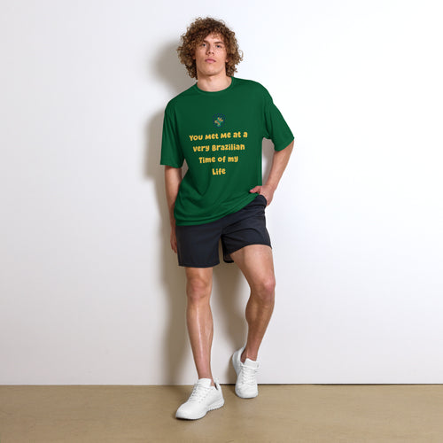 Model wearing a forest-green graphic performance tee with yellow lettering
