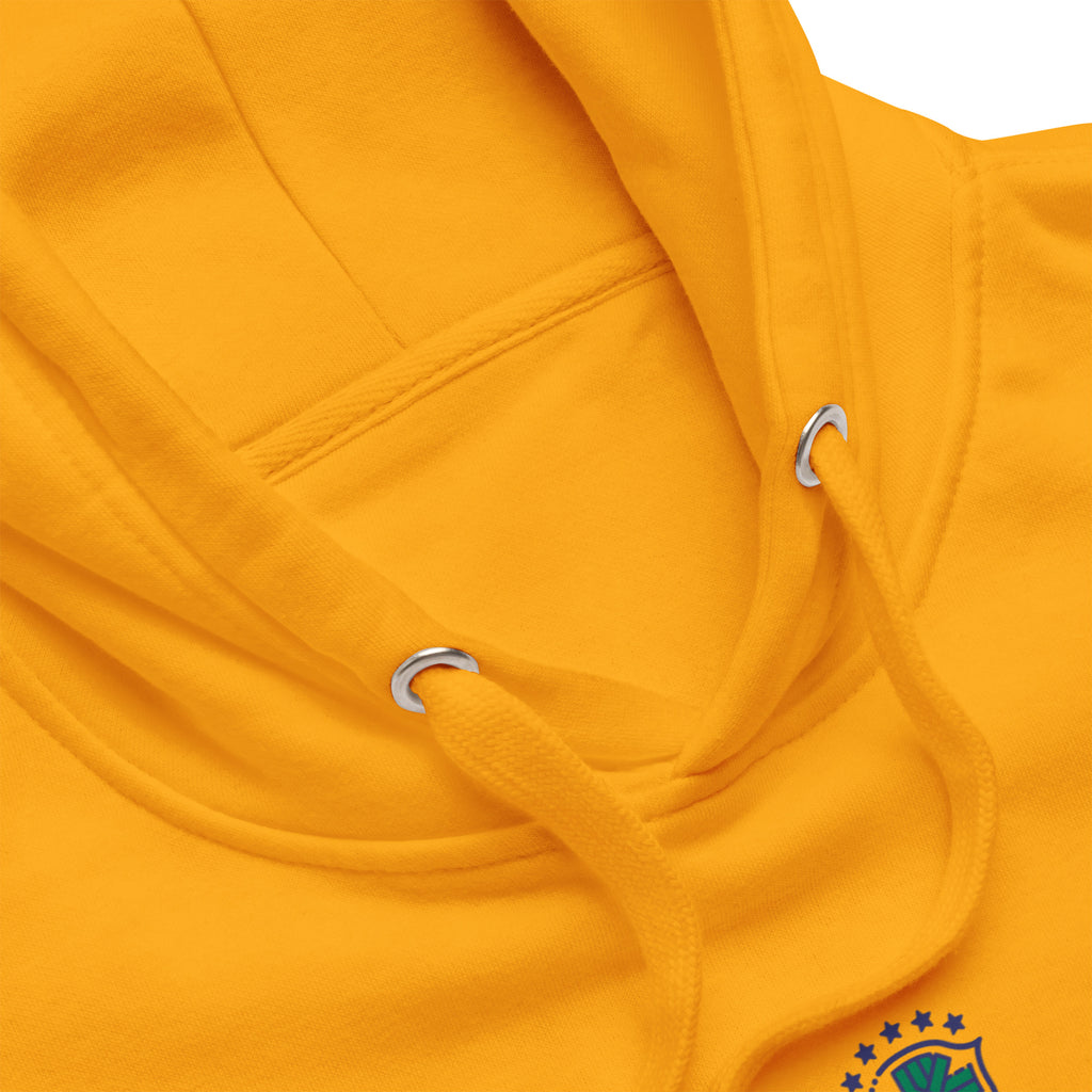 Close-up of the gold hoodie's neckline, hood and matching drawstrings